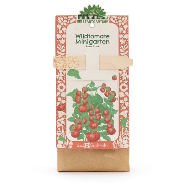 Anzuchtset „Wildtomate Minigarten“ von Die Stadtgärtner, Verpackung mit Illustration einer Tomatenpflanze und Holzstecker.