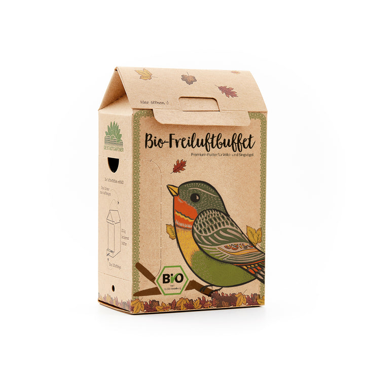 Bio-Freiluftbuffet Verpackung für Premium-Vogelfutter mit einem illustrierten Vogel und Herbstlaub.