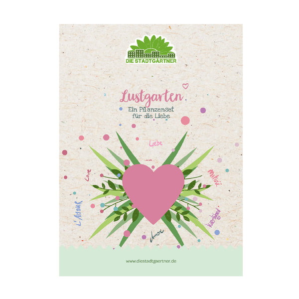 Verpackung eines Pflanzensets mit einem großen rosa Herz, grünen Blättern und dem Schriftzug „Lustgarten – Ein Pflanzenset für die Liebe“ auf beige Hintergrund.