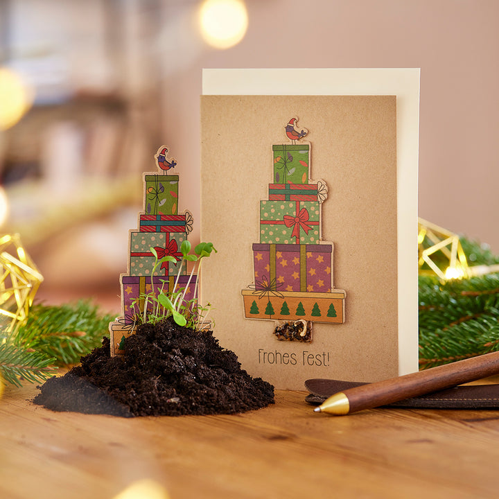 Karte zu Weihnachten mit Geschenken - Text "Frohes Fest"
