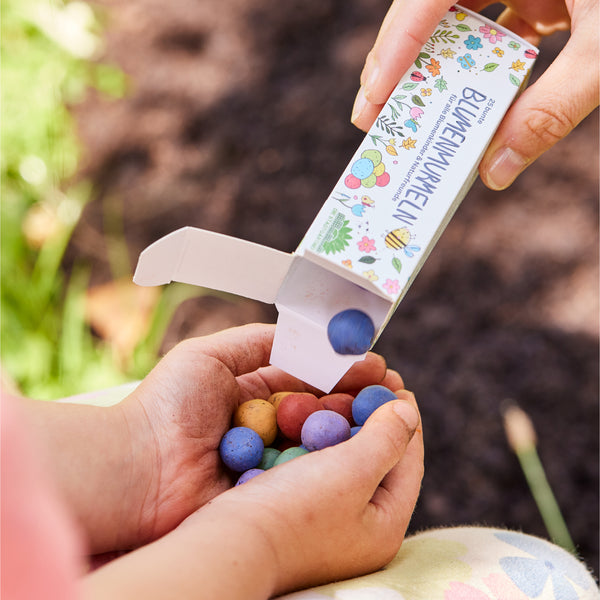 25 Blumenmurmeln in einer Faltschachtel