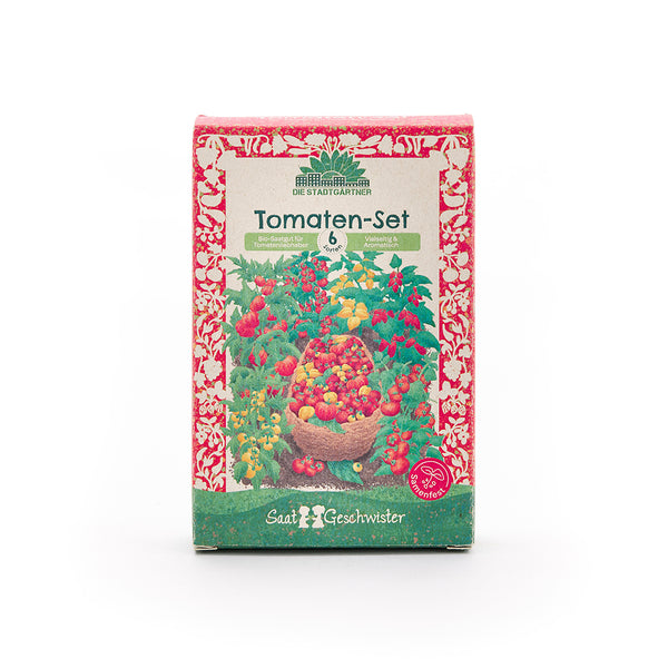 Verpackung eines Tomaten-Sets mit buntem Tomatenmotiv und der Aufschrift "Tomaten-Set – 6 Sorten – Bio-Saatgut für Tomatenliebhaber" auf Deutsch.
