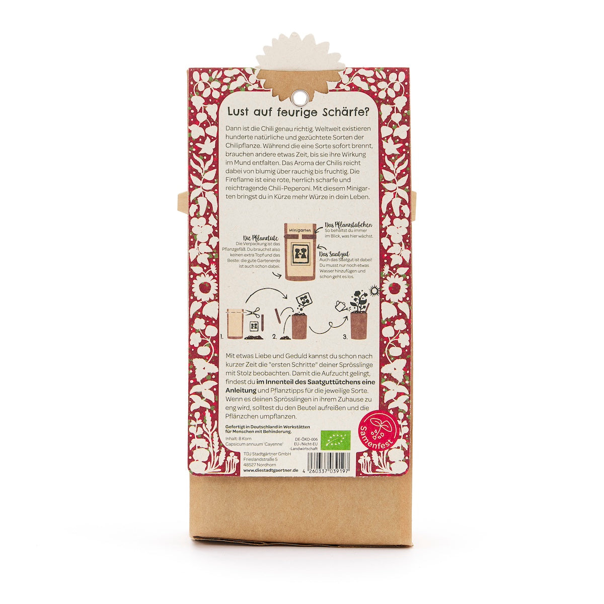 Rückseite einer Verpackung mit einer Anleitung zum Anpflanzen von Chili, umgeben von rotem, blumigem Muster, mit Text und Illustrationen auf Deutsch.