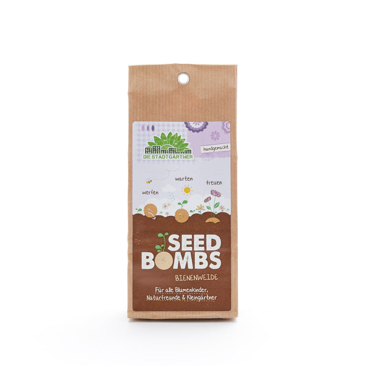 Braune Verpackung von "Seed Bombs Bienenweide" mit Illustrationen und Anweisungen zum Aussäen von Samen.