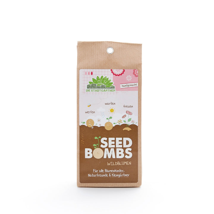 Verpackung von 'Seed Bombs Wildblumen' auf weißem Hintergrund.